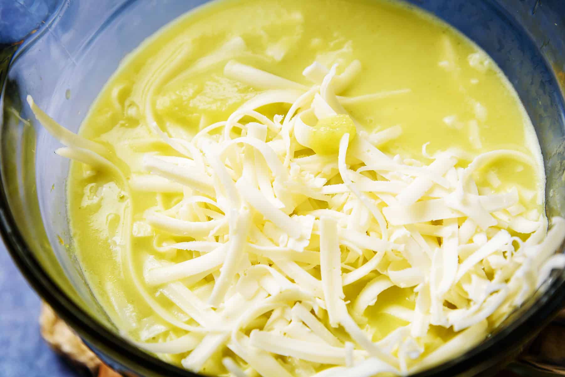 Adding the cheese to the Creamy Vegan Celery Soup