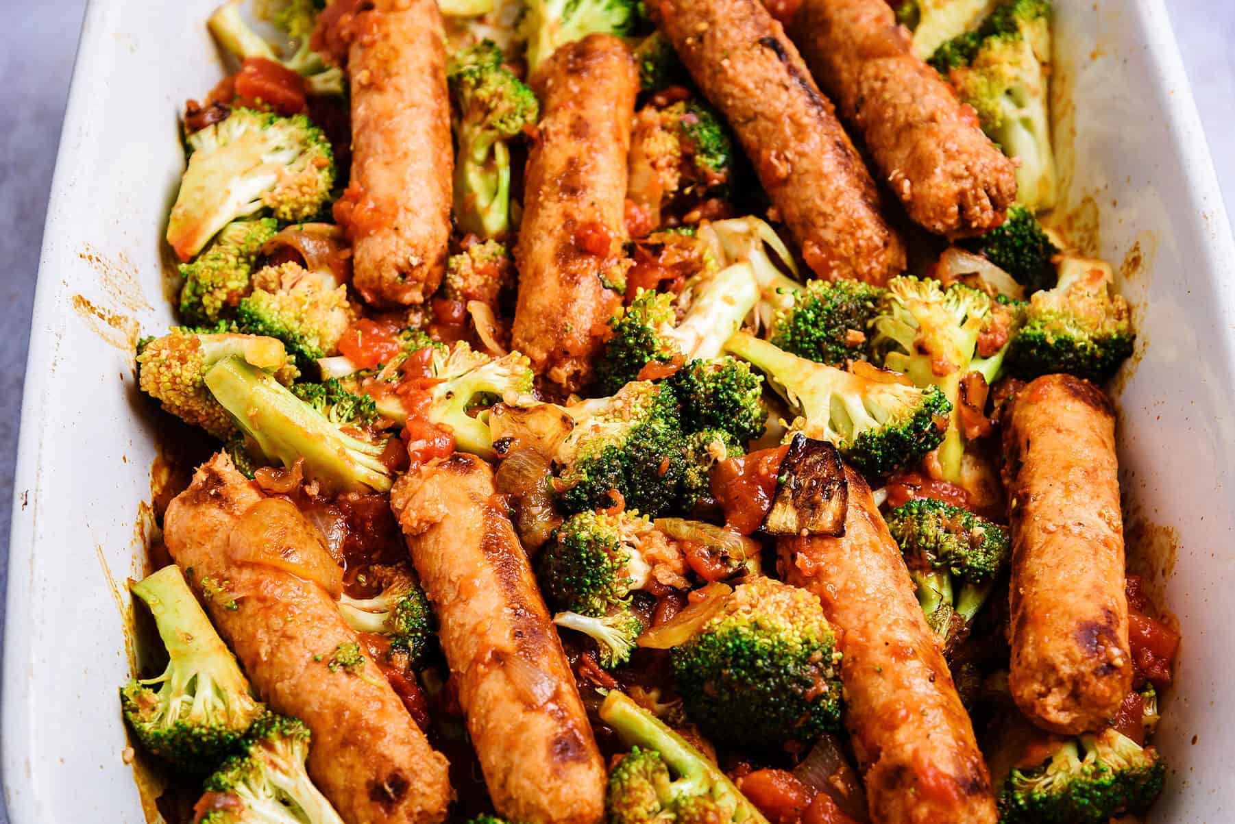 Cooked ingredients for Vegan Sausage & Potato Bake in an ovenproof dish