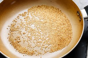 Pan toasted sesame seeds in a frying pan