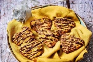 Heart-shaped Vegan Oat & Apricot Cookies on a cloth