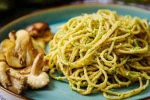 A plate of spaghetti with Pea & Greek Basil Pesto