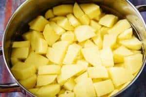 Diced potatoes in a pan with water