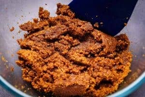 Melted butter mixed into biscuit crumbs