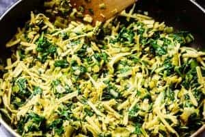 Mixing the cheese into the cooled spinach & leeks
