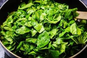 Spinach added to the pan