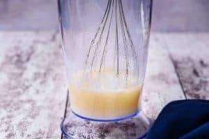 Starting to whisk the ingredients with an electric hand-held whisk