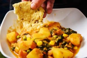 Tear & Share Steamed Flatbread dipped in curry