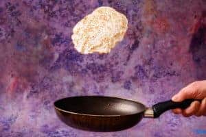 Tossing the crepe in the pan
