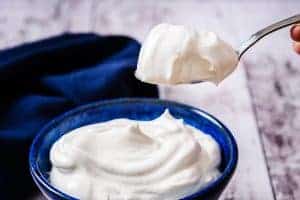 Vegan Sweetened Whipped Cream on a spoon