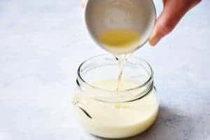 Pouring the vinegar into the soya milk