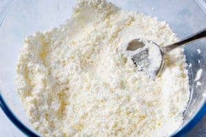 Vegan butter mixed into the icing sugar in a bowl