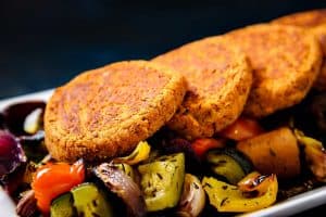 Lentil & Kidney Bean Patties on roasted vegetables
