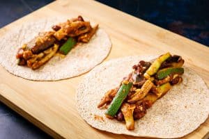 Open mini tortillas with filling placed in the middle