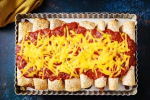 Overhead view of Close up of Vegan Vegetable & Bean Enchiladas in an oven dish