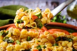 Warm Asparagus & Pasta Salad on a serving spoon