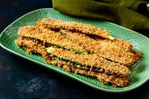 Baked Breaded Cajun Courgettes on a serving platter