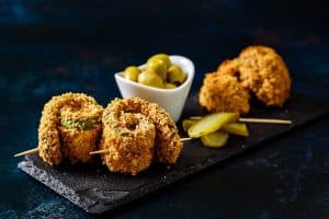 Baked Breaded Cajun Courgettes served as part of a mezze board