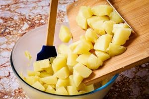 Adding potatoes to the indienne sauce