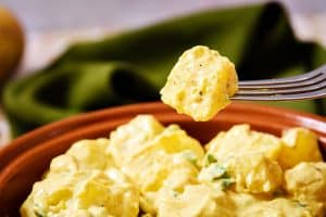 Vegan Potato Salad Indienne on a fork